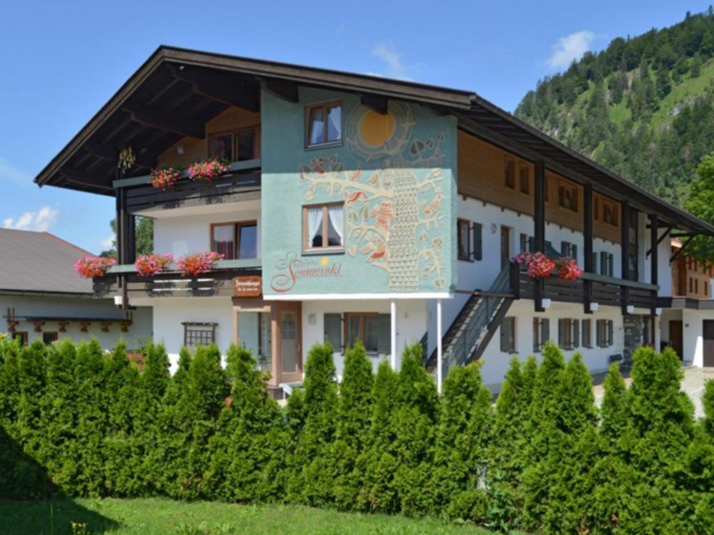 un edificio con un cartel en el costado en Residenz Sonnwinkl, en Reit im Winkl