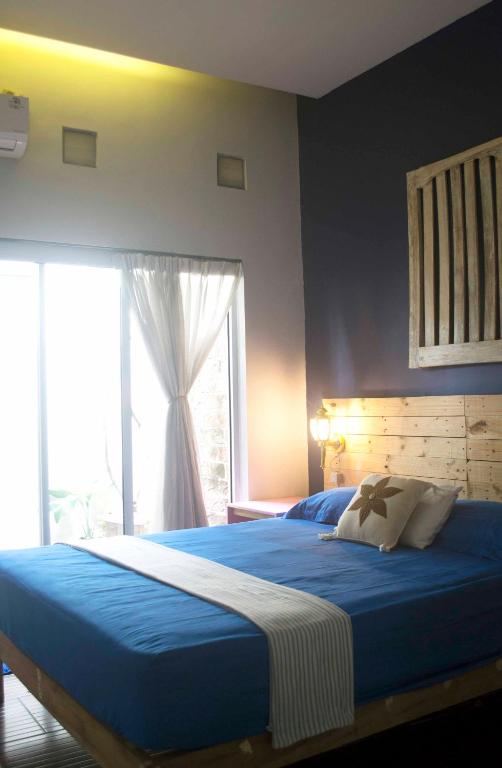 Postel nebo postele na pokoji v ubytování Cipta Guesthouse