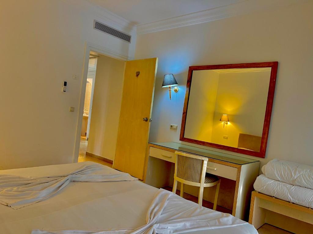 Postel nebo postele na pokoji v ubytování Residence Royal - Deluxe