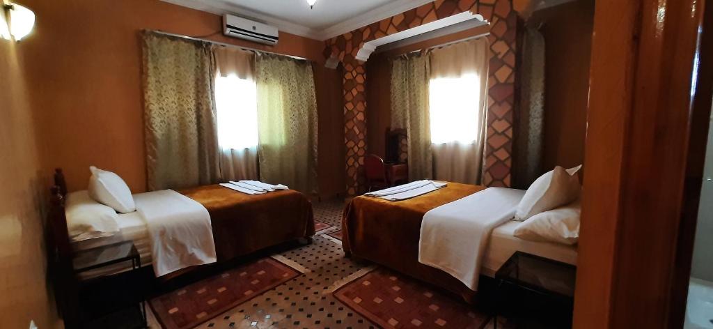 Postel nebo postele na pokoji v ubytování Hotel Marmar