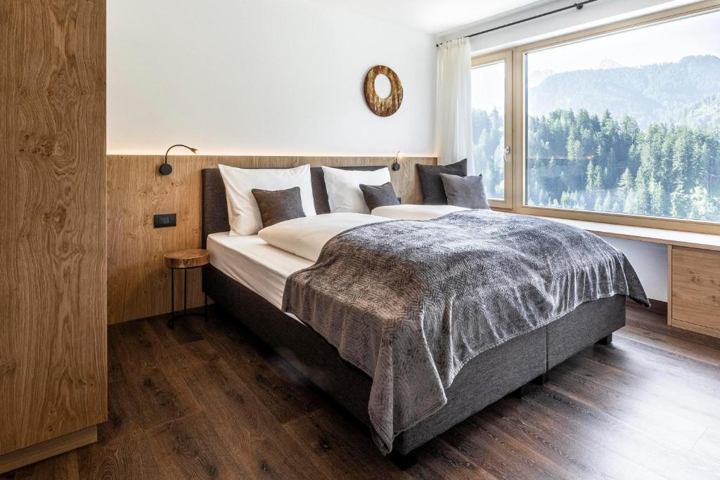 Posteľ alebo postele v izbe v ubytovaní Apartment Ravison