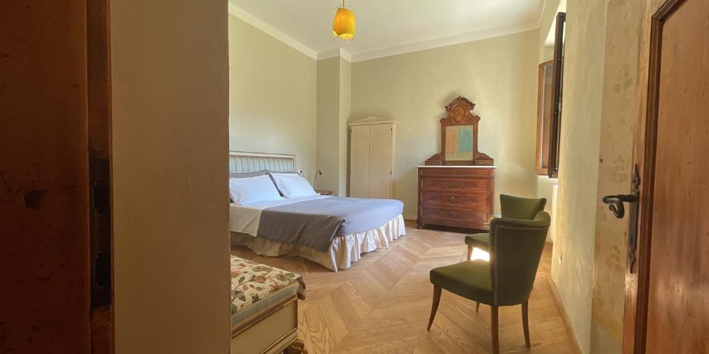 Postel nebo postele na pokoji v ubytování Palazzo Gatteschi