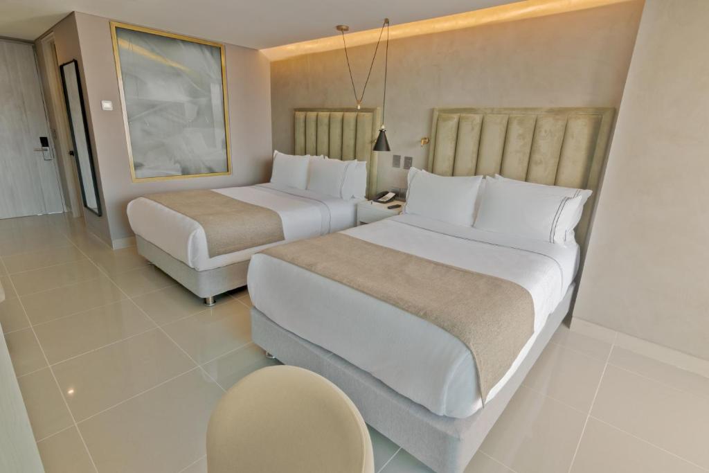 Postel nebo postele na pokoji v ubytování Sonesta Hotel Cartagena