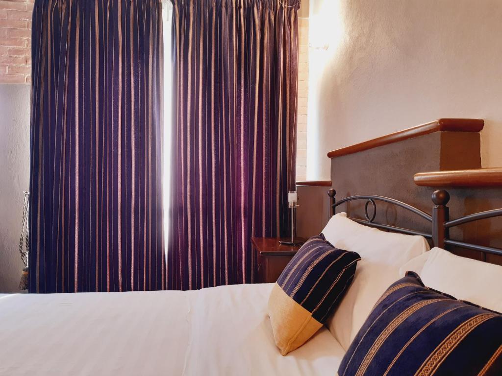 Postel nebo postele na pokoji v ubytování Red Wine Camere