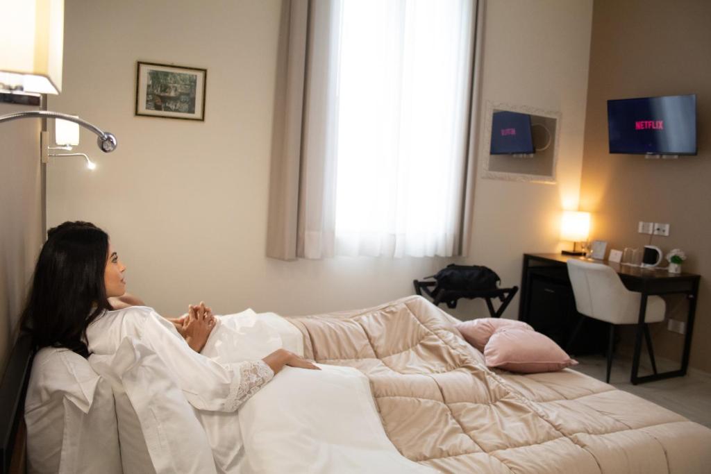 Posteľ alebo postele v izbe v ubytovaní B&B De Nava Suite