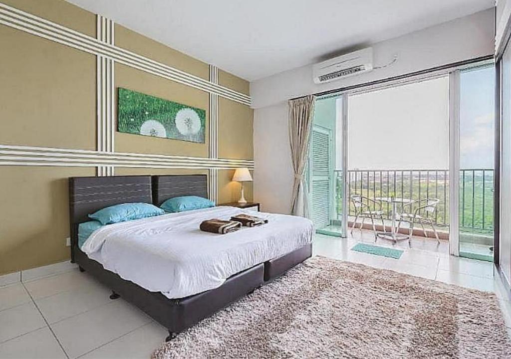 a bedroom with a large bed and a large window at 5min Mid Valley Southkey 10min KSL CIQ City Square in Johor Bahru