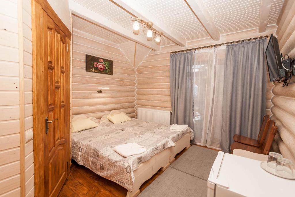 Postel nebo postele na pokoji v ubytování Guest house М