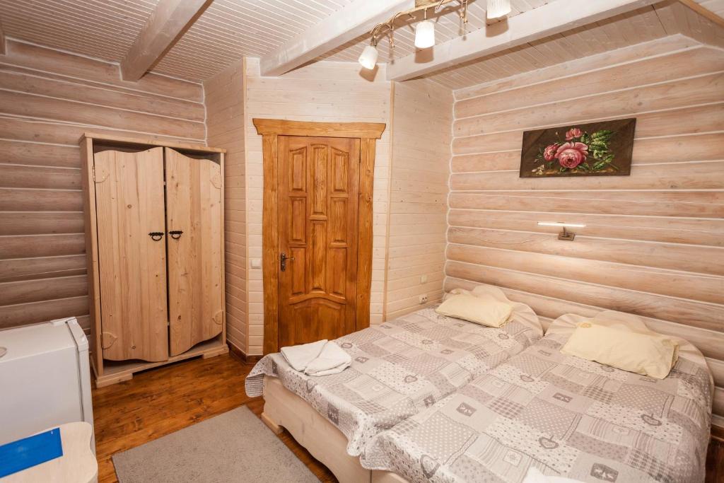 Postel nebo postele na pokoji v ubytování Guest house М