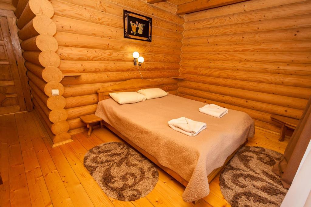 Postel nebo postele na pokoji v ubytování Guest house М