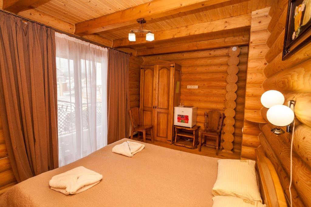 Postel nebo postele na pokoji v ubytování Guest house М