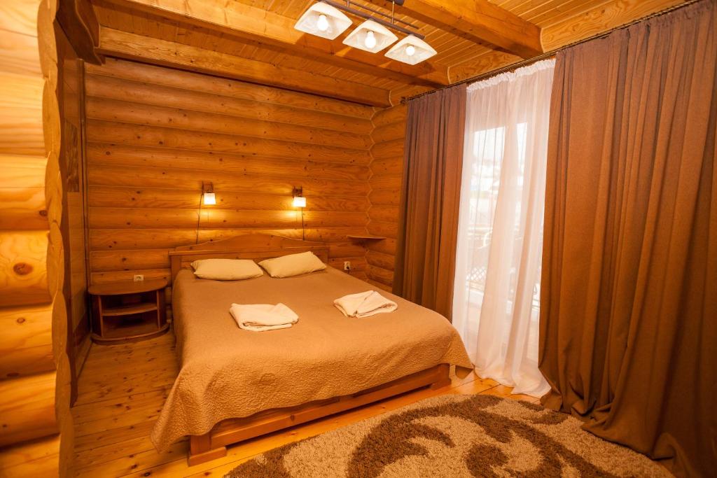 Postel nebo postele na pokoji v ubytování Guest house М