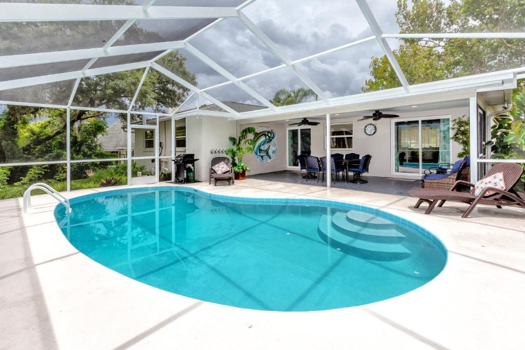 an image of a swimming pool in a house at Modern Home, Heated Pool, Close to Beaches! in Tarpon Springs