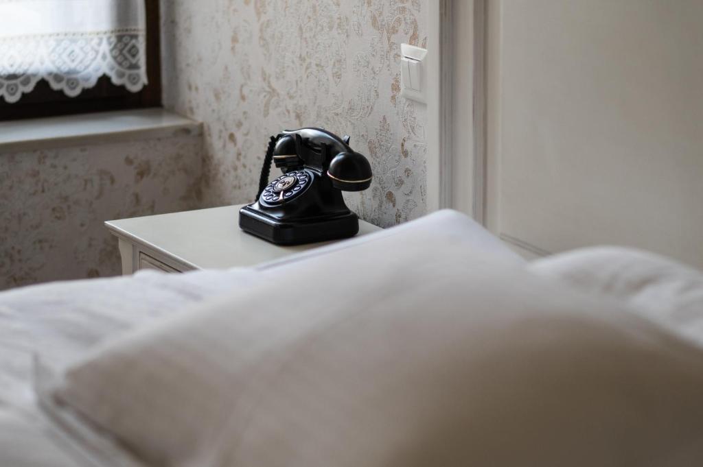 Łóżko lub łóżka w pokoju w obiekcie Boutique Hotel Anagennisis