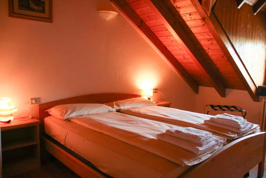 Posteľ alebo postele v izbe v ubytovaní Locanda Aurora B&B