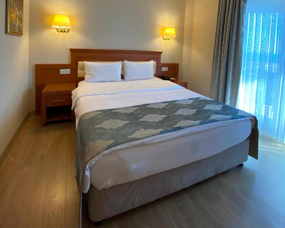 a bedroom with a large bed in a room at Premier Vista Hotel in Silivri