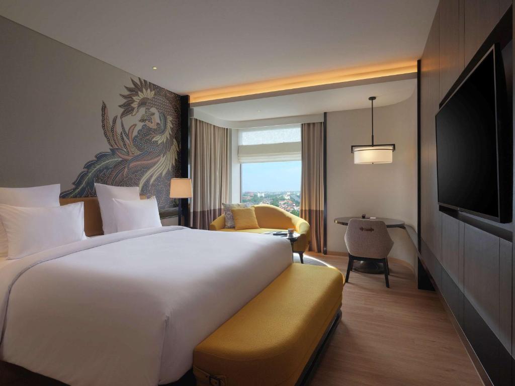 Rúm í herbergi á Pullman Bandung Grand Central