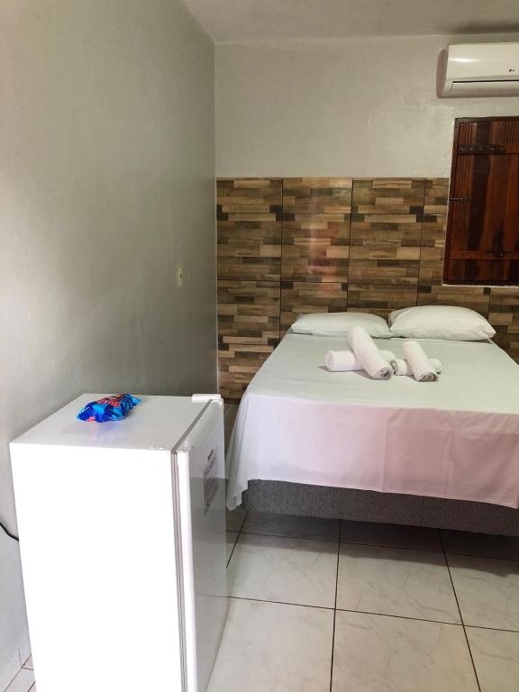 Uma cama ou camas num quarto em Pousada Encanto dos Anjos