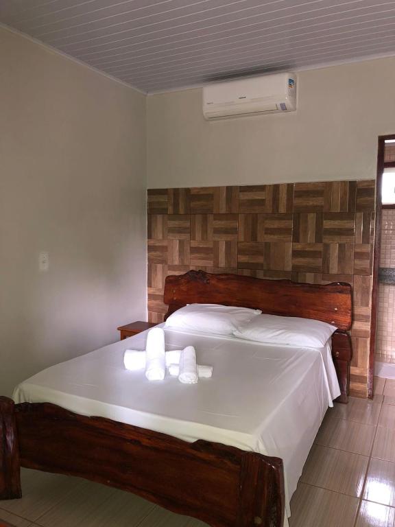 Uma cama ou camas num quarto em Pousada Encanto dos Anjos