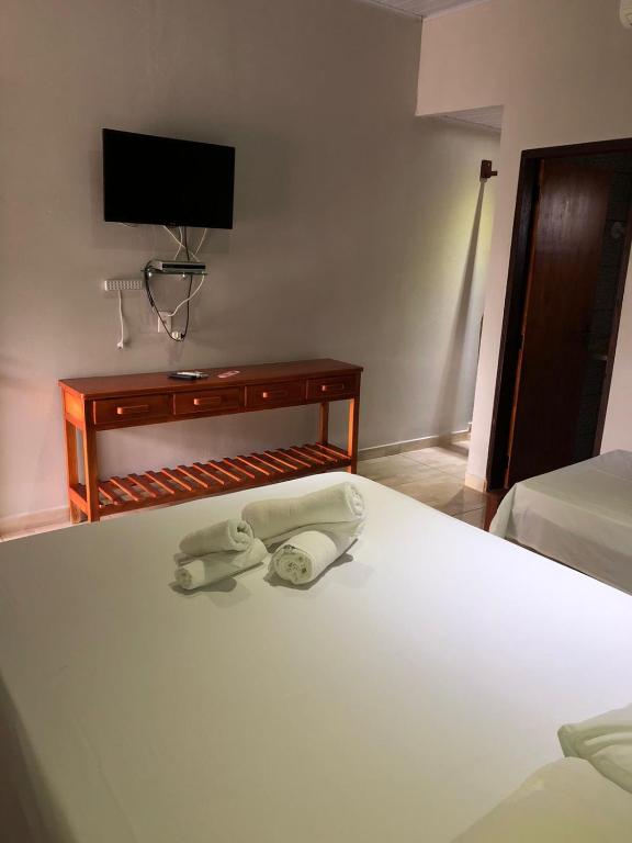Uma cama ou camas num quarto em Pousada Encanto dos Anjos