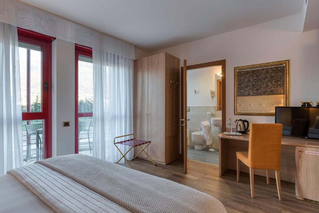 Postel nebo postele na pokoji v ubytování Hotel Sporting Trento