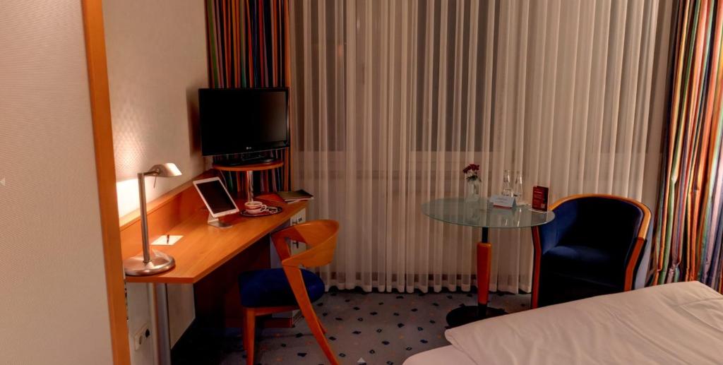 TV a/nebo společenská místnost v ubytování Business-Hotel Artes