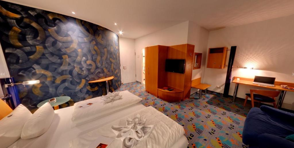 Postel nebo postele na pokoji v ubytování Business-Hotel Artes