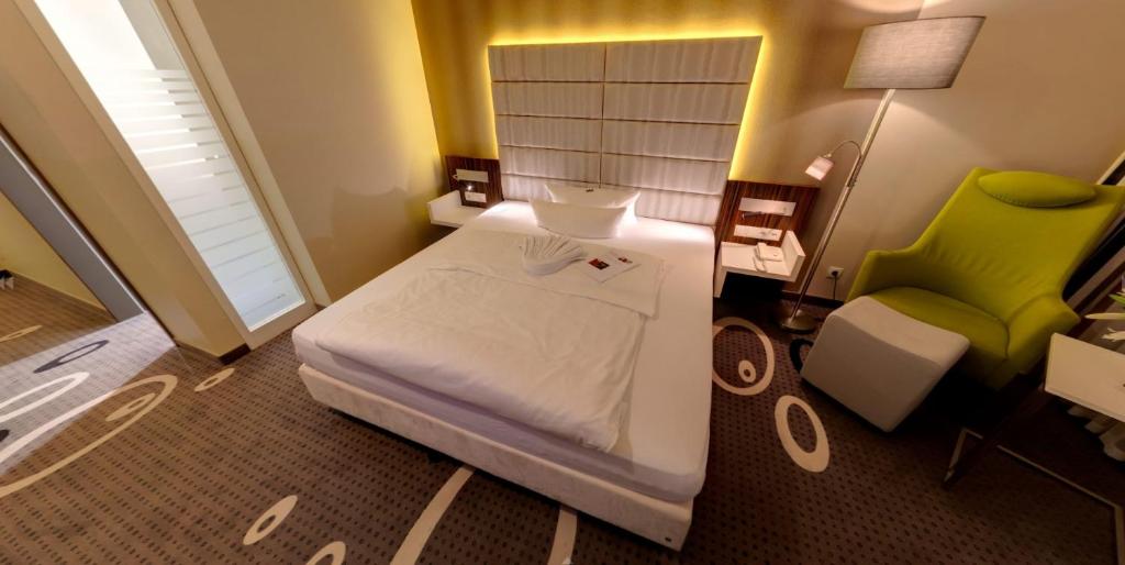 Postel nebo postele na pokoji v ubytování Business-Hotel Artes