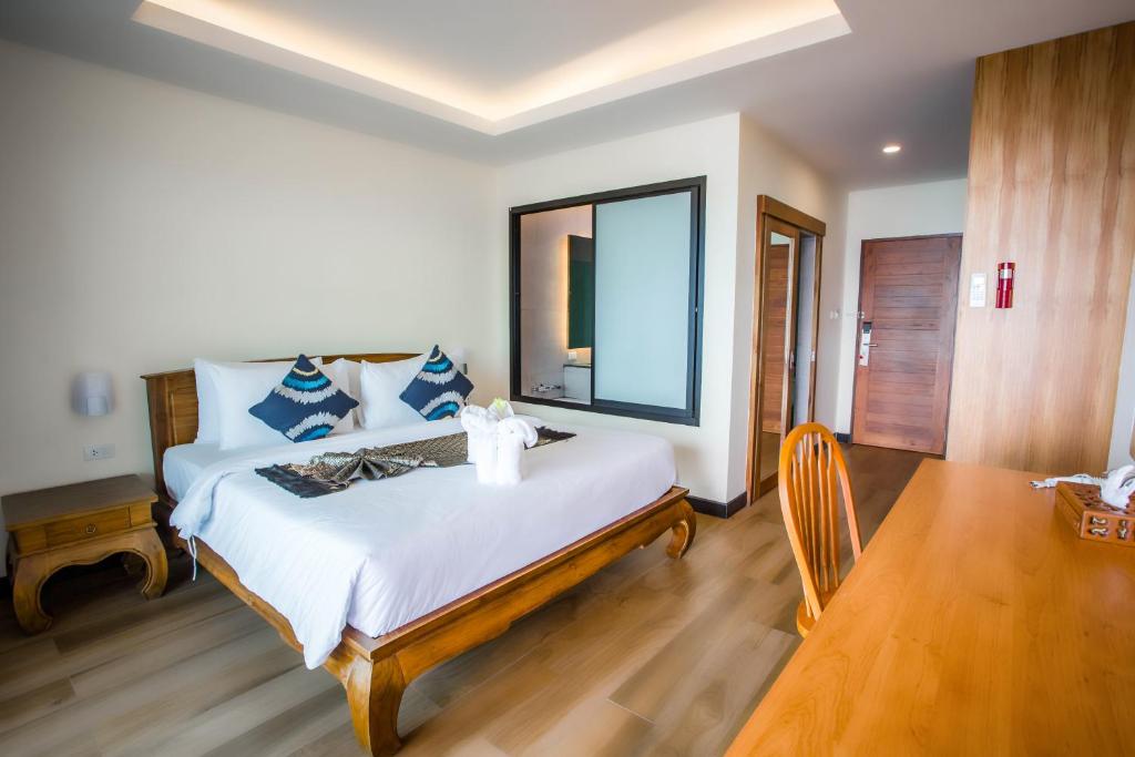 Postel nebo postele na pokoji v ubytování Samui Bayview Resort & Spa - SHA Plus