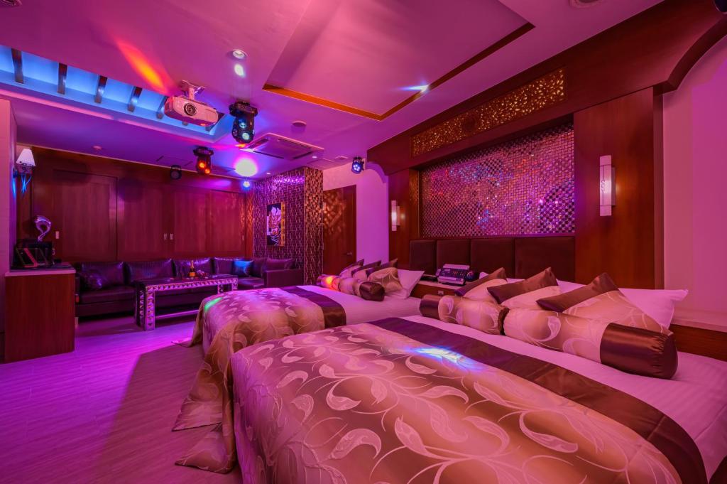 Postel nebo postele na pokoji v ubytování HOTEL Dior7つくば