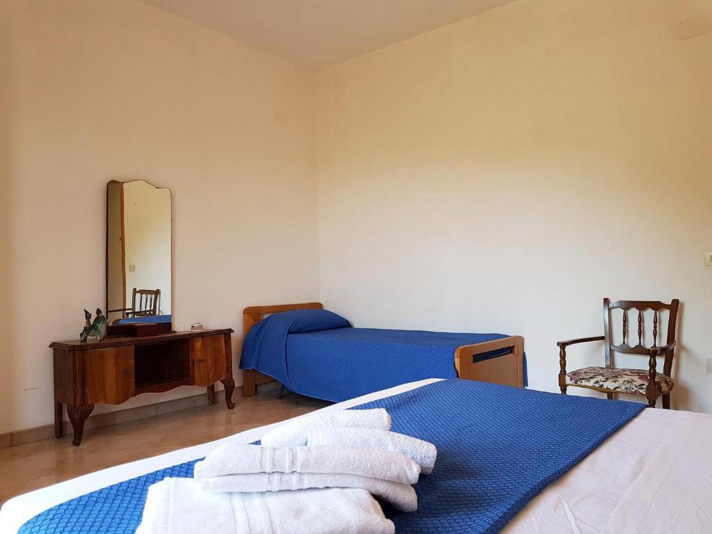 Postel nebo postele na pokoji v ubytování Il Limoneto 2, casa vacanze Parghelia-Tropea