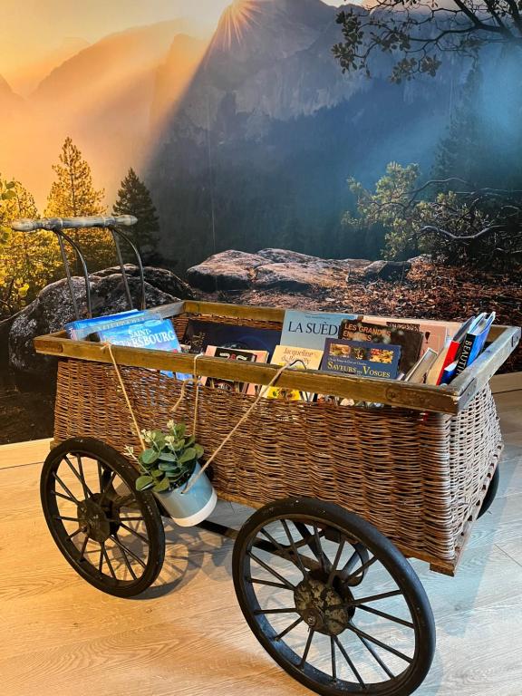 a picnic cart with a basket on a table at Colombages de la Lauch in Colmar