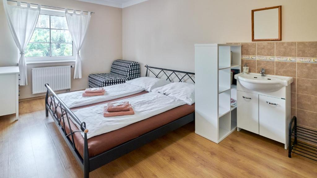 Postel nebo postele na pokoji v ubytování Relax hotel Valaška