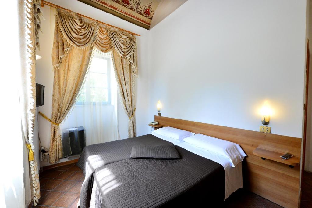 Postel nebo postele na pokoji v ubytování Hotel Iris
