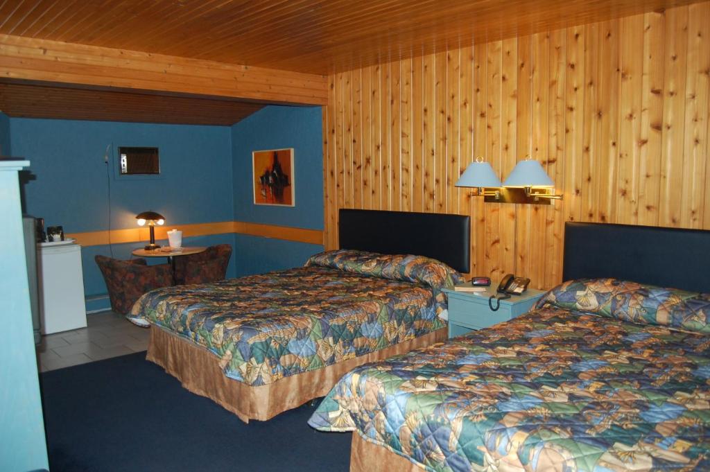Postel nebo postele na pokoji v ubytování Auberge Godard