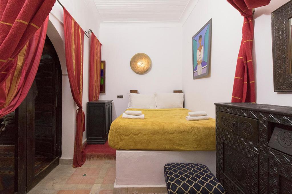 Postel nebo postele na pokoji v ubytování Riad Wardate Rita