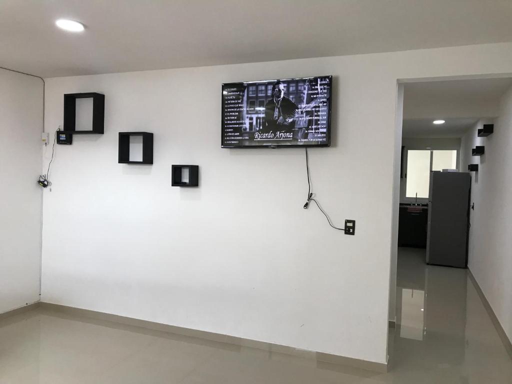 TV a/nebo společenská místnost v ubytování Casa minimalista tranquila y acogedora, con garage