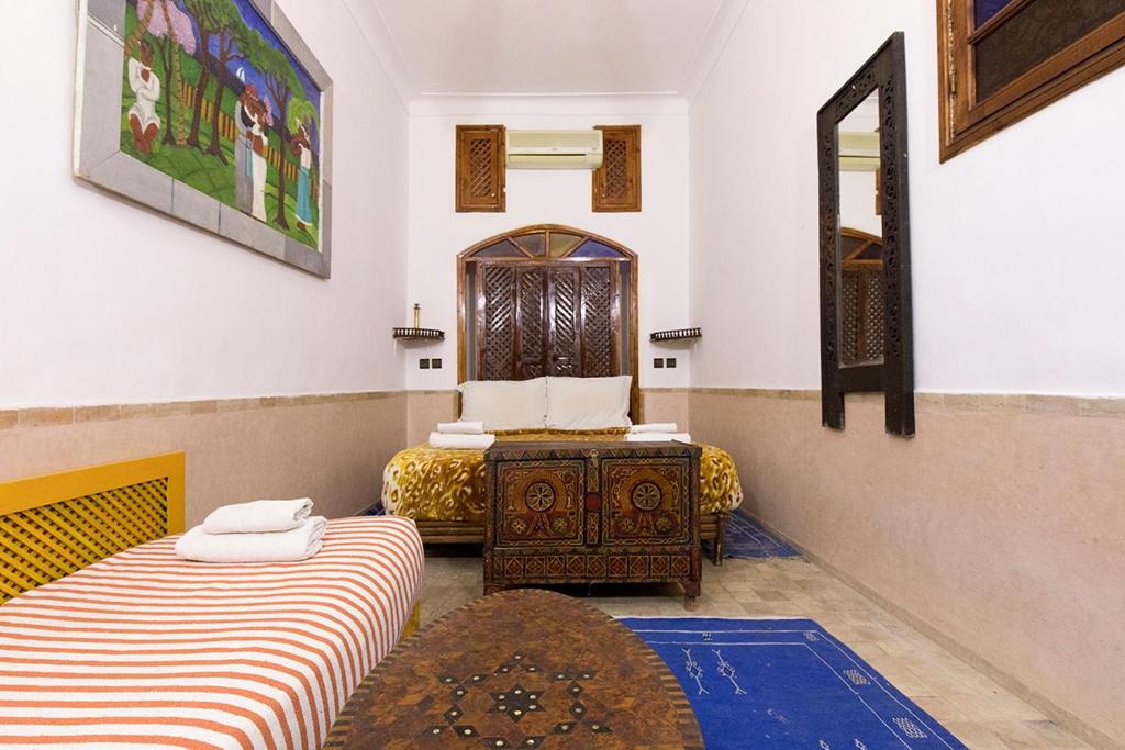 Postel nebo postele na pokoji v ubytování Riad Wardate Rita