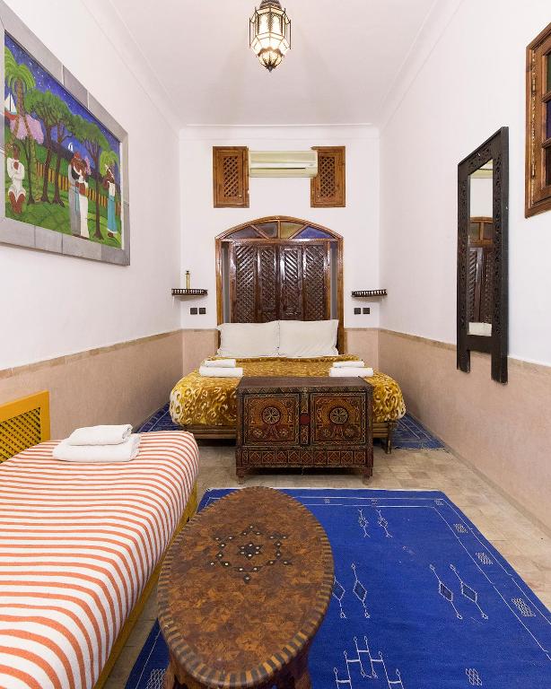 Postel nebo postele na pokoji v ubytování Riad Wardate Rita