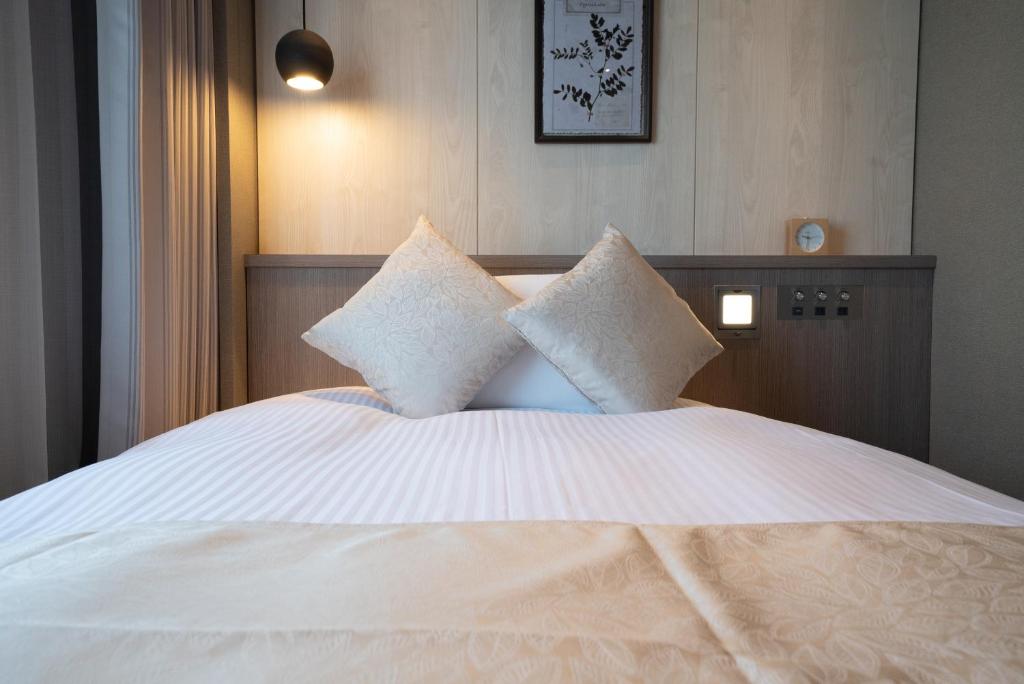 Postel nebo postele na pokoji v ubytování Hotel Grand View Takasaki