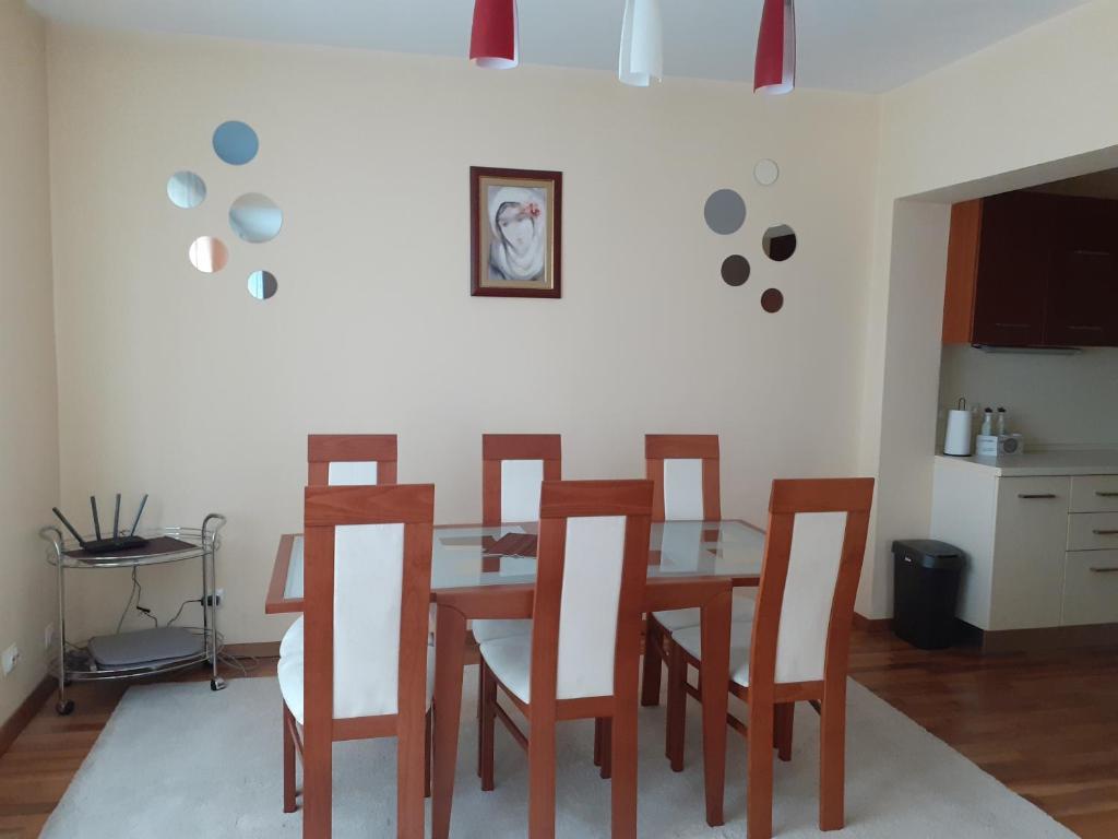 a dining room with a table and chairs at Statevi Guest Apartment in Velingrad