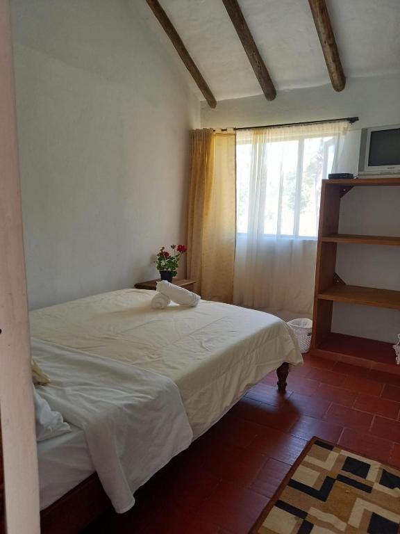 Postel nebo postele na pokoji v ubytování Cabaña Lewana Campestre