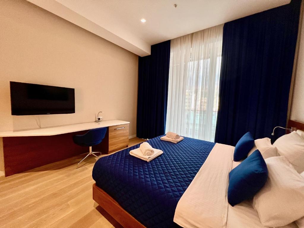 Postel nebo postele na pokoji v ubytování Condo Studio Plaza