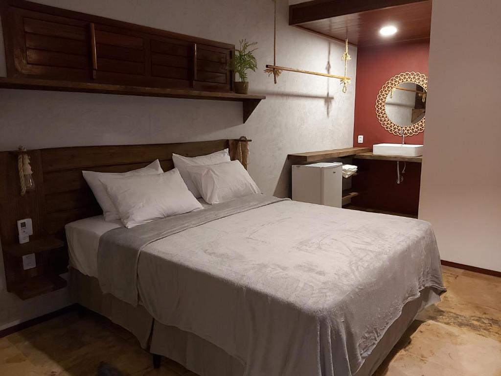 Krevet ili kreveti u jedinici u okviru objekta Pousada Flor de Lena- suíte Lírio -Icaraizinho