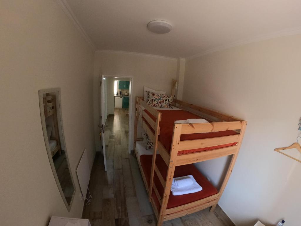 Postel nebo postele na pokoji v ubytování Pé na Areia, Alojamento Local