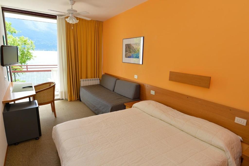 Postel nebo postele na pokoji v ubytování Hotel Lido
