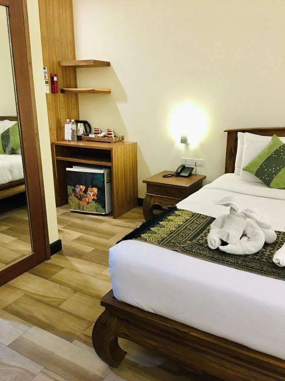 Postel nebo postele na pokoji v ubytování Samui Bayview Resort & Spa - SHA Plus