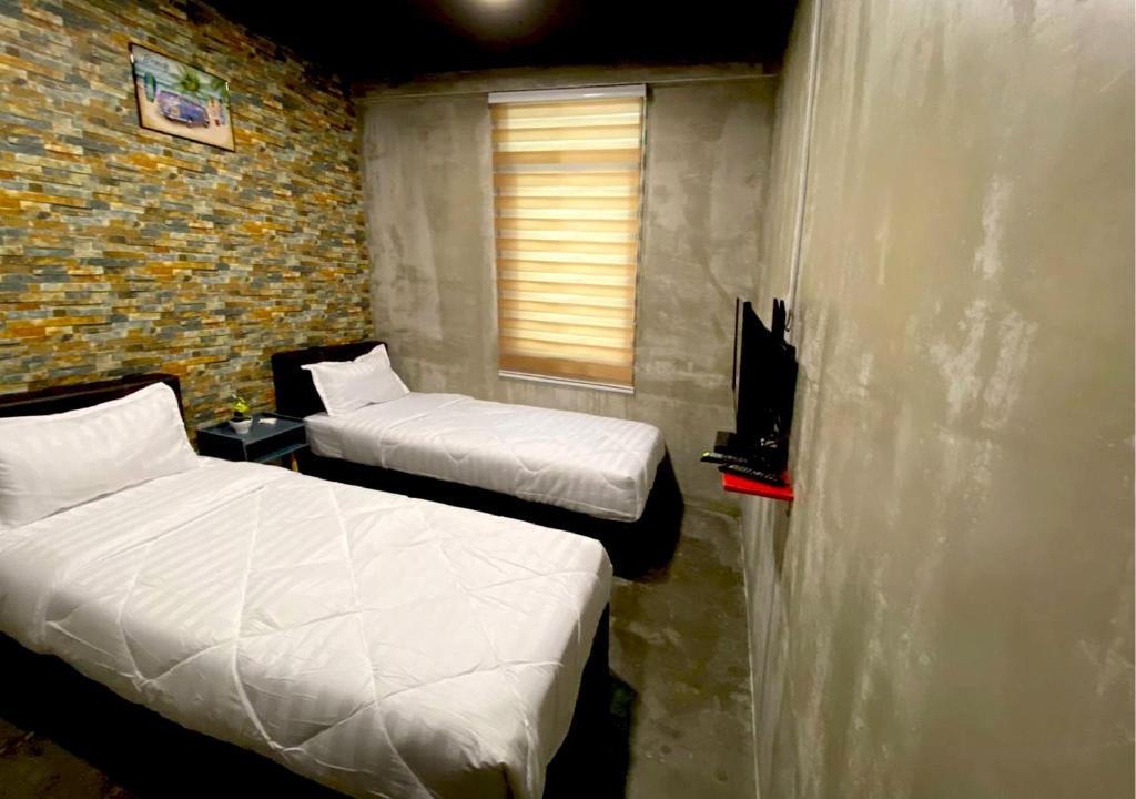 Postel nebo postele na pokoji v ubytování Hotel EC KIP Sentral KLIA 1 - KLIA 2