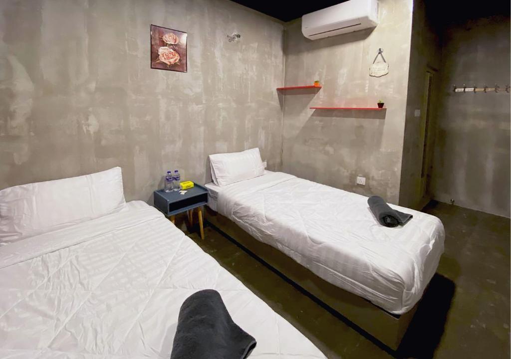 Postel nebo postele na pokoji v ubytování Hotel EC KIP Sentral KLIA 1 - KLIA 2