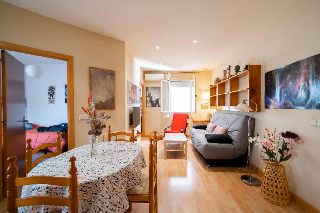 a living room with a table and a couch at Atocha Center in Madrid