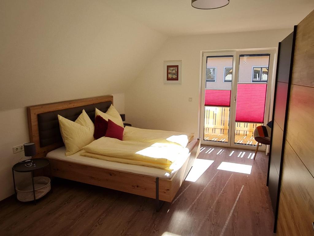 Postel nebo postele na pokoji v ubytování FrIda Appartements